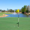 A sunny day view of a hole at Heritage Oaks Golf Club.