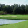A view of a green with water and bunkers coming into play at Southern Hills Golf Club.