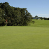 A view of the 1st hole with the clubhouse in the background at Apple Mountain Resort.