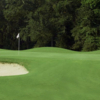 A view of a green flaked by bunkers at Griffin Bell Golf & Conference Center