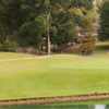 A view over the water of a green at Panola Mountain Golf Club