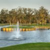 A view of a green surrounded by water at Heritage Oaks Golf Club
