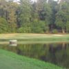 A view of a green with bunkers and water coming into play at Landings Golf Club