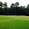 A view of a green protected by sand traps at Laurel Island Links