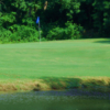 A view over the water of a green at Pine Hills Golf Club