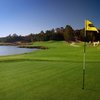 A view of green surrounded by water at Legacy on Lanier Golf Club