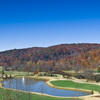 A view of a green near the lake at Achasta Golf Club