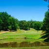 A view of hole #11 surrounded by water at Innsbruck Golf Club