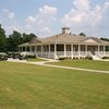 A view of the clubhouse and golf carts at Collins Hill Golf Club