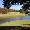 A green view surrounded by water at Hickory Ridge Golf Club