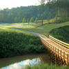 A view of the brifge over the water and green in background at Bear's Best