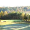 A fall view of a green protected by bynkers at Callahan Golf Links