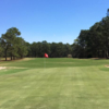 A sunny day view of a green at Evans Heights Golf Club.