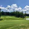 A sunny day view of a hole at Chestatee Golf Club.