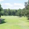 A sunny day view of a fairway at RiverPines Golf Course.